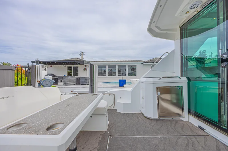 Low Hours!!! Yacht Photos Pics 2012 Cruisers Yachts 48 Cantius deck with modern amenities and outdoor seating.