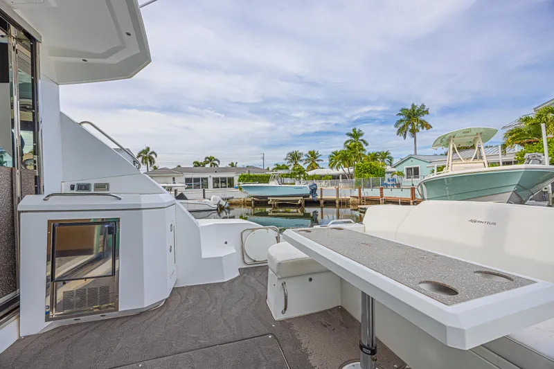 Low Hours!!! Yacht Photos Pics 2012 Cruisers Yachts 48 Cantius docked, featuring spacious deck and modern amenities.