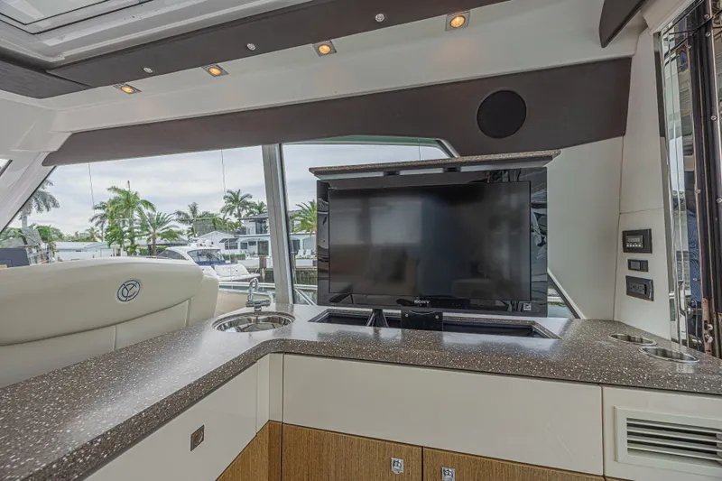 Low Hours!!! Yacht Photos Pics Luxurious interior of 2012 Cruisers Yachts 48 Cantius with TV and modern amenities.