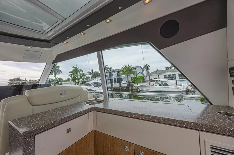 Low Hours!!! Yacht Photos Pics Interior view of 2012 Cruisers Yachts 48 Cantius with waterfront scenery.