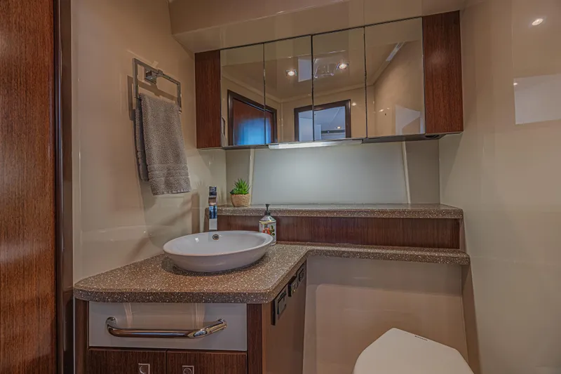 Low Hours!!! Yacht Photos Pics Luxurious bathroom interior of 2012 Cruisers Yachts 48 Cantius with modern fixtures.