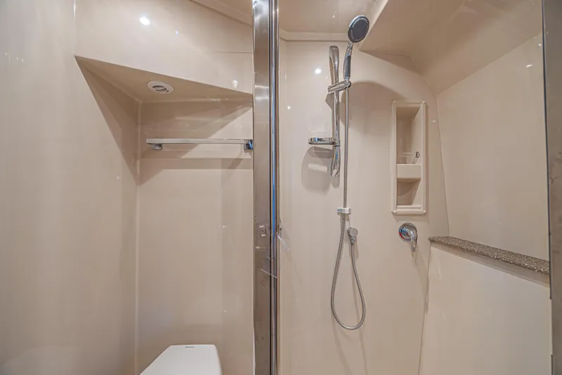 Low Hours!!! Yacht Photos Pics Luxurious shower in 2012 Cruisers Yachts 48 Cantius, featuring modern fixtures and sleek design.