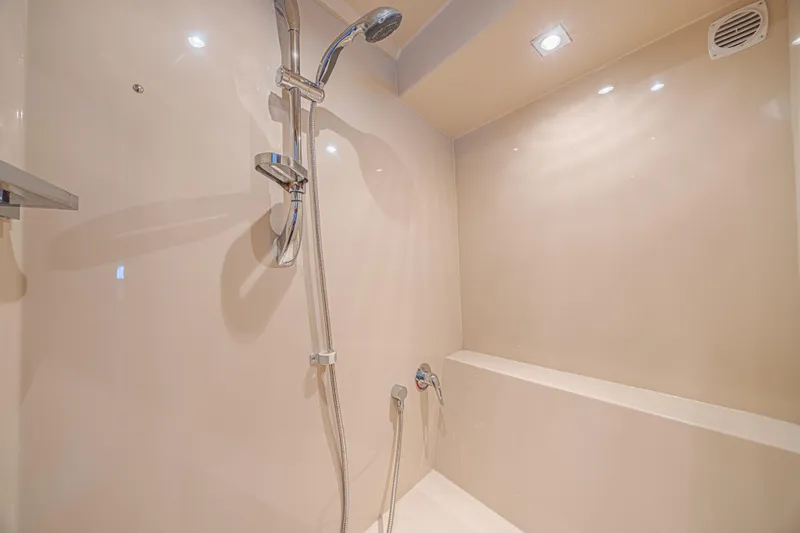 Low Hours!!! Yacht Photos Pics Luxurious shower area in 2012 Cruisers Yachts 48 Cantius, featuring modern fixtures.