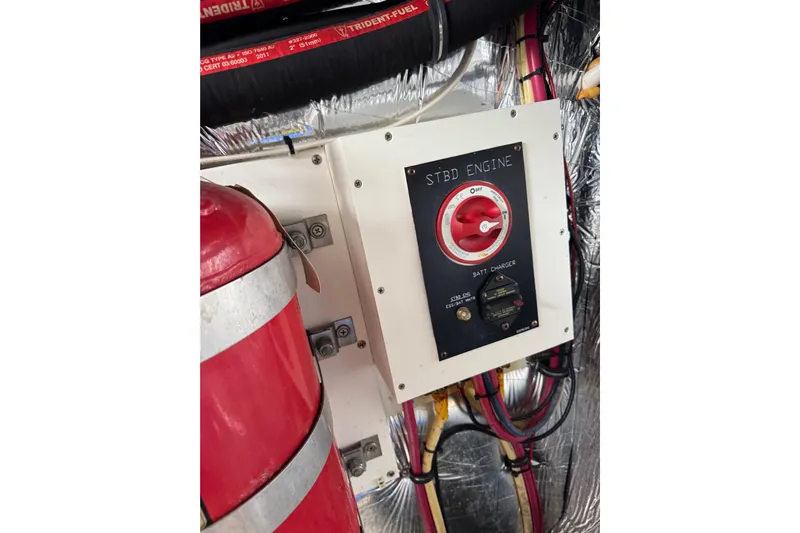 Low Hours!!! Yacht Photos Pics Engine control panel on 2012 Cruisers Yachts 48 Cantius, featuring battery charger and wiring.