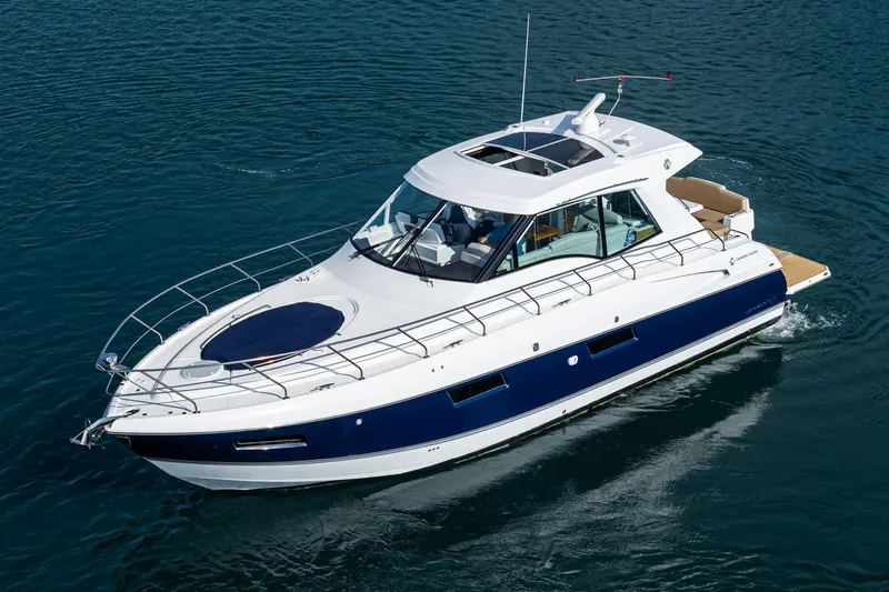 Serenity Yacht Photos Pics 2015 Cruisers Yachts 48 Cantius cruising on calm blue waters.