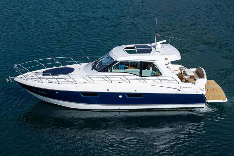 Serenity Yacht Photos Pics 2015 Cruisers Yachts 48 Cantius luxury boat on calm water.