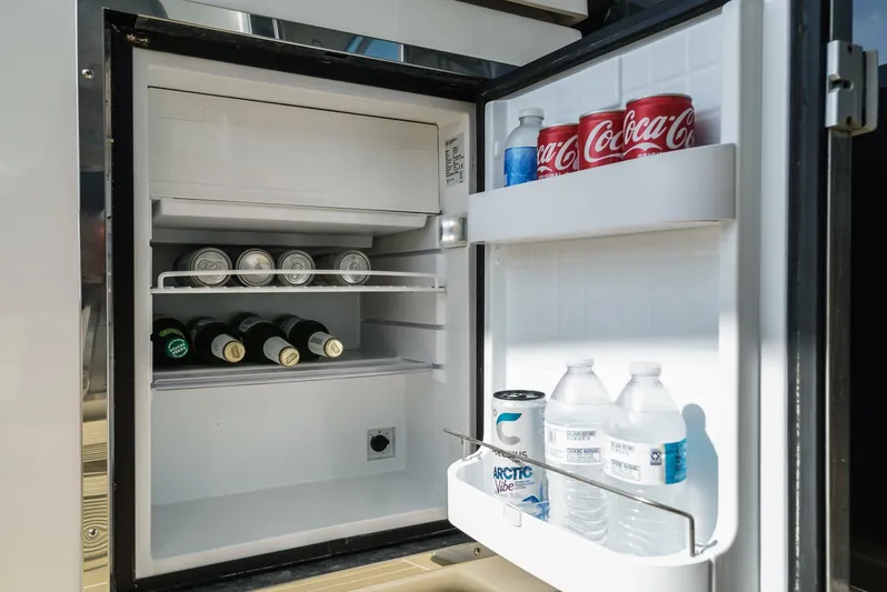 Serenity Yacht Photos Pics Mini fridge stocked with drinks on 2015 Cruisers Yachts 48 Cantius.