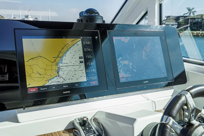 Serenity Yacht Photos Pics Navigation screens on 2015 Cruisers Yachts 48 Cantius, displaying maps and data.