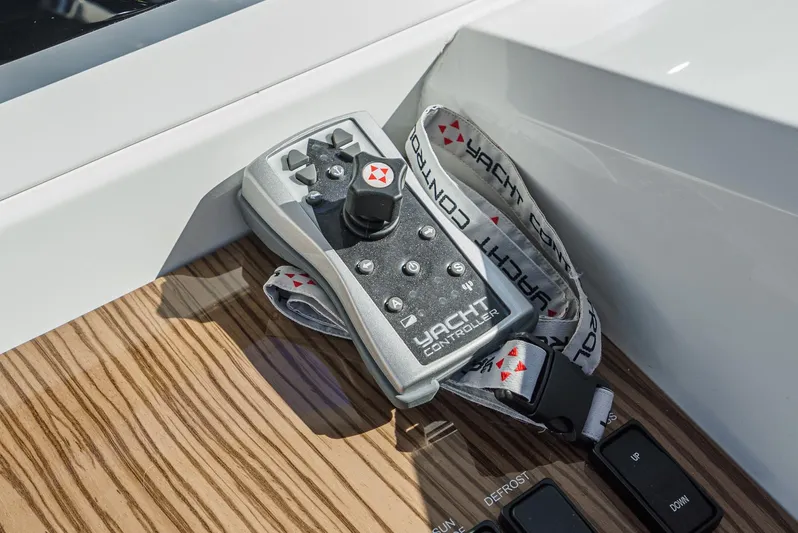 Serenity Yacht Photos Pics Remote control on a 2015 Cruisers Yachts 48 Cantius, featuring yacht control system.