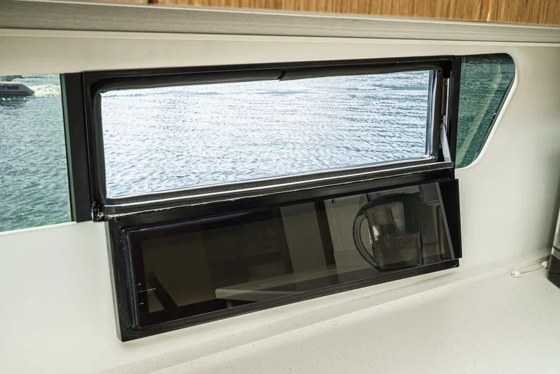 Serenity Yacht Photos Pics Interior window view on 2015 Cruisers Yachts 48 Cantius, overlooking water.