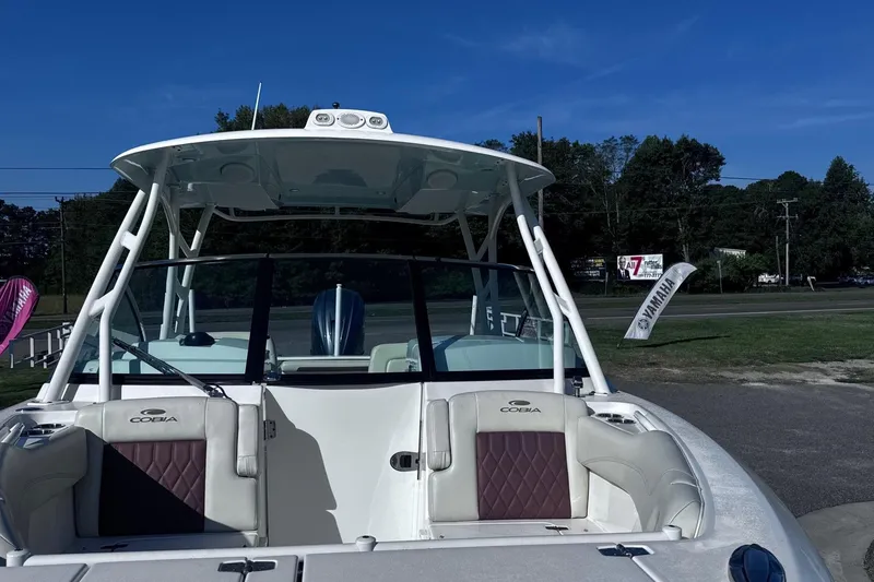 Hey Babe Yacht Photos Pics 2020 Cobia 280DC boat with Yamaha engine, parked outdoors under clear blue sky.
