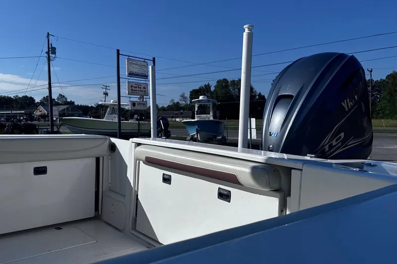 Hey Babe Yacht Photos Pics 2020 Cobia 280DC boat with Yamaha outboard motor at a service center.