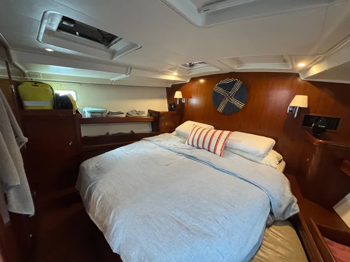 Liquid Sunshine Yacht Photos Pics Luxurious cabin interior of 2005 Beneteau 523 Oceanis yacht with cozy bedding.