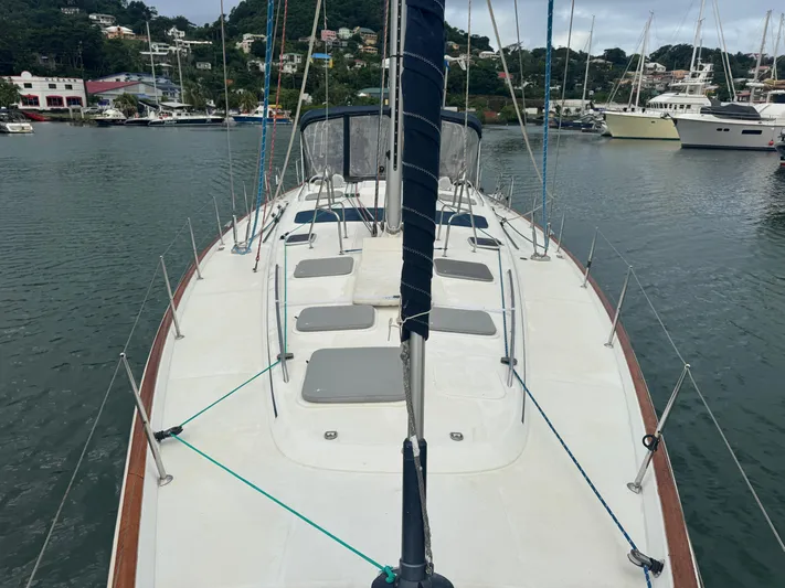 Liquid Sunshine Yacht Photos Pics 2005 Beneteau 523 Oceanis sailboat docked in a marina, showcasing spacious deck layout.