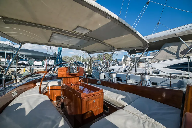 Spirit Of Galatea Yacht Photos Pics 2014 Spirit Yachts sailboat interior with wooden finish and cushioned seating at marina.