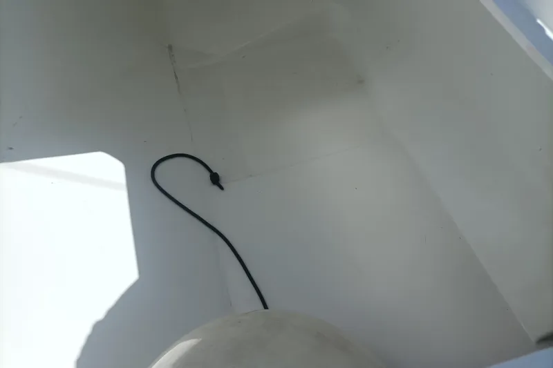 Ritual Yacht Photos Pics Interior view of a 2020 Beneteau First 53 sailboat, featuring a clean, white compartment.