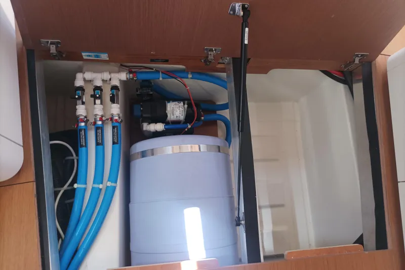 Ritual Yacht Photos Pics Beneteau First 53 (2020) yacht plumbing system with blue pipes and water pump.