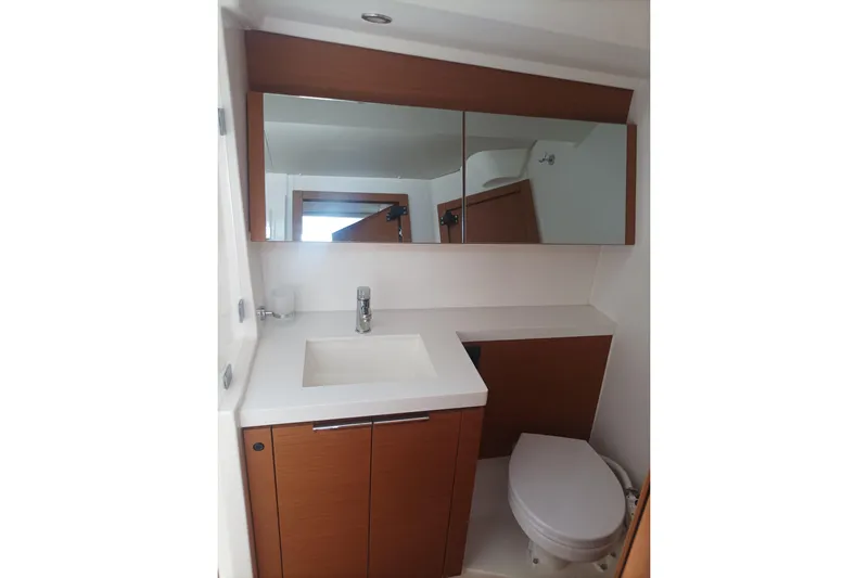 Ritual Yacht Photos Pics Modern bathroom in a 2020 Beneteau First 53 yacht, featuring sleek cabinetry and fixtures.