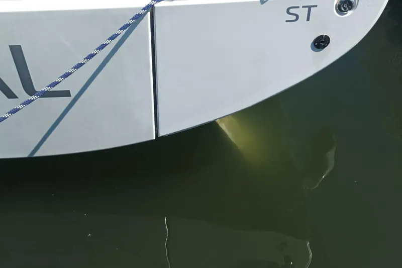 Ritual Yacht Photos Pics Close-up of a 2020 Beneteau First 53 yacht stern, partially submerged in water.
