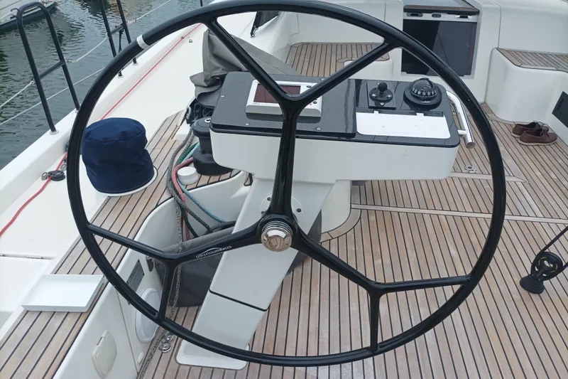 Ritual Yacht Photos Pics Steering wheel of a 2020 Beneteau First 53 yacht with teak deck.