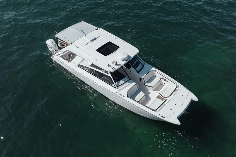  Yacht Photos Pics 2024 World Cat 400 DC-X boat cruising on open water, aerial view.