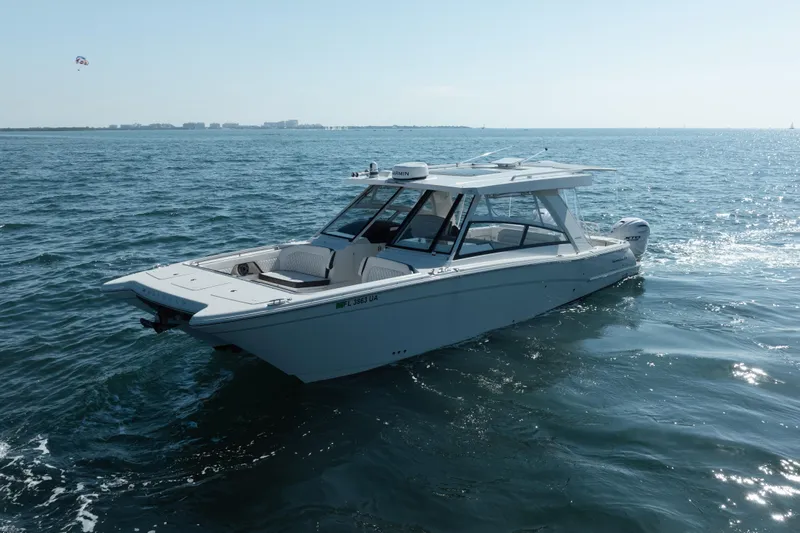  Yacht Photos Pics 2024 World Cat 400 DC-X boat cruising on open water under clear skies.