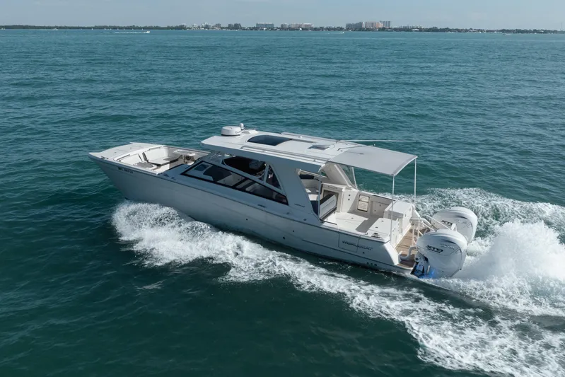  Yacht Photos Pics 2024 World Cat 400 DC-X cruising on open water, showcasing sleek design and powerful engines.
