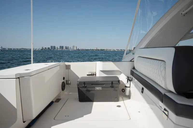 Yacht Photos Pics 2024 World Cat 400 DC-X boat interior with seating and cooler, ocean view.