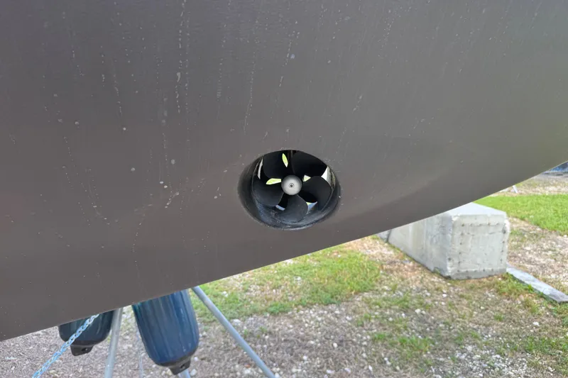 True North Yacht Photos Pics Bow thruster on 2004 Island Packet 420 sailboat hull, displayed on land.