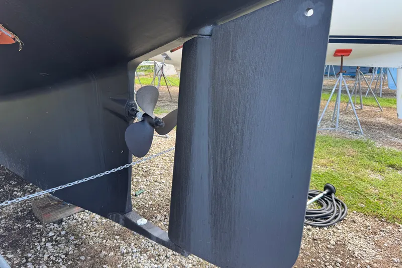 True North Yacht Photos Pics Close-up of 2004 Island Packet 420 sailboat propeller and rudder on dry dock.