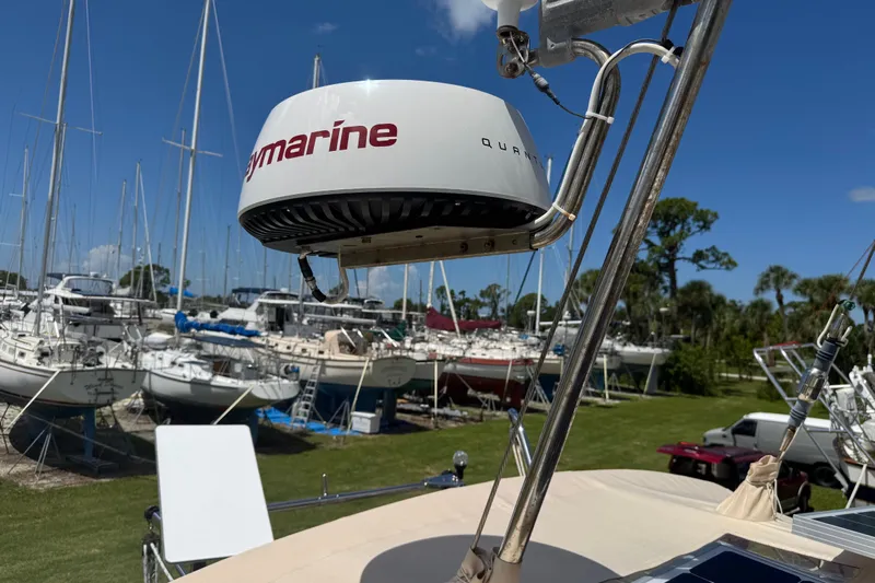 True North Yacht Photos Pics Radar equipment on a 2004 Island Packet 420 sailboat, docked among other vessels.