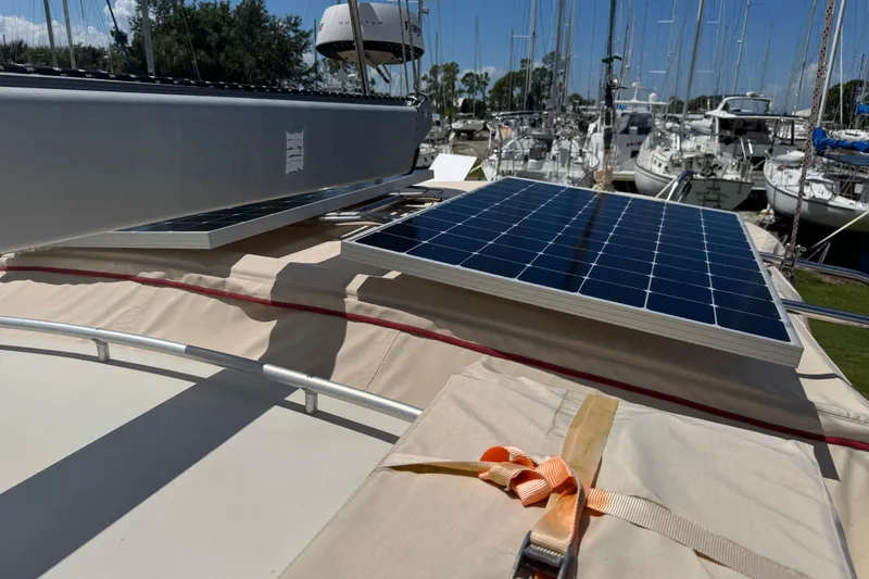 True North Yacht Photos Pics 2004 Island Packet 420 sailboat with solar panels in a marina setting.