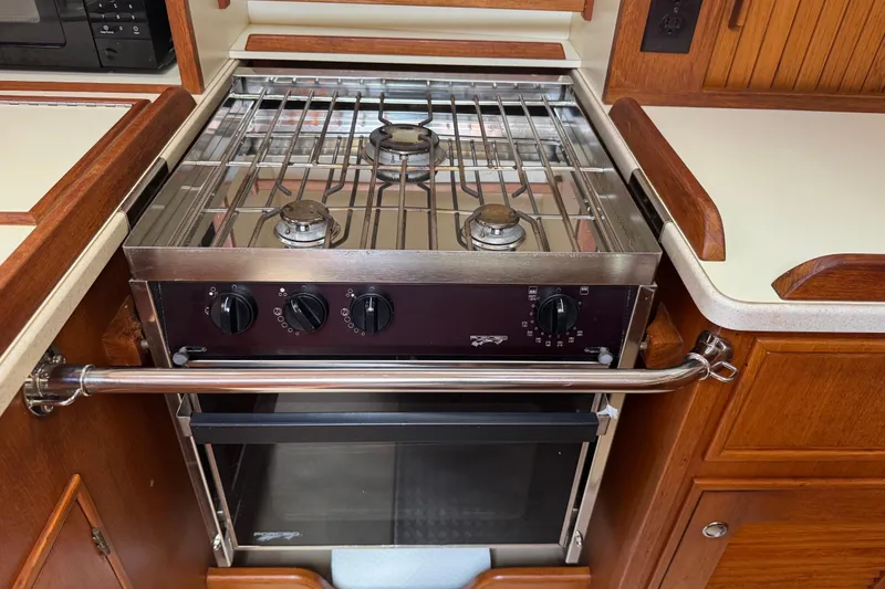 True North Yacht Photos Pics Stainless steel stove in 2004 Island Packet 420 yacht kitchen.