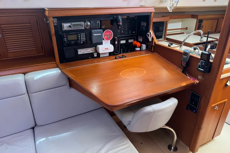 True North Yacht Photos Pics Navigation station on a 2004 Island Packet 420 yacht with communication equipment.