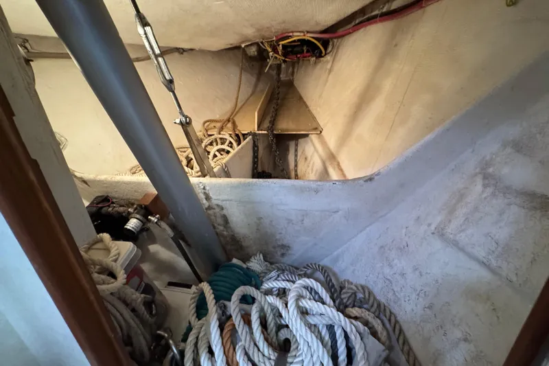 True North Yacht Photos Pics Interior of 2004 Island Packet 420 sailboat showing ropes and anchor chain storage.