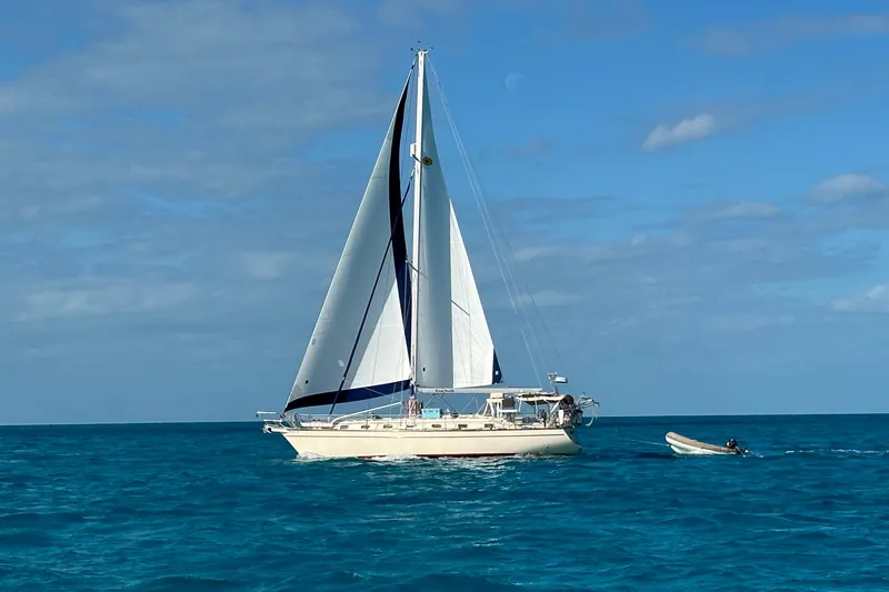 True North Yacht Photos Pics Sailing yacht Island Packet 420, 2004 model, cruising on clear blue ocean waters.