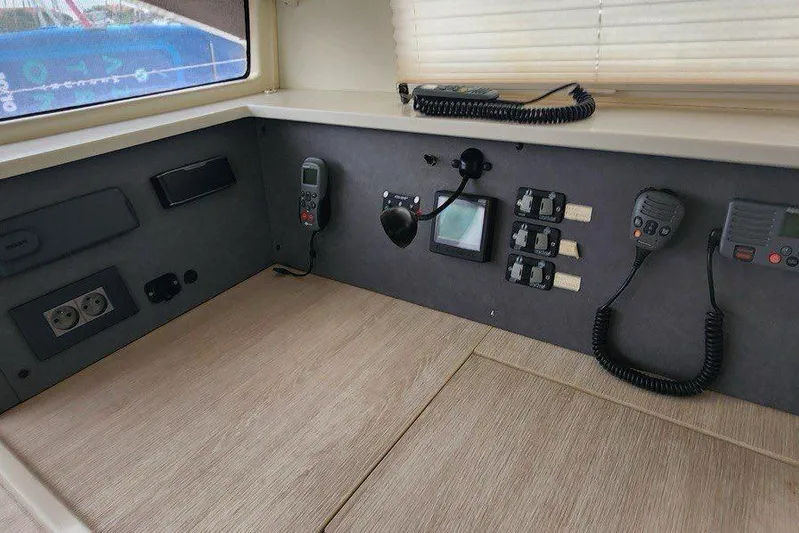 Jolly Dacha Yacht Photos Pics Control panel of a 2015 Leopard 48 yacht with communication devices and switches.
