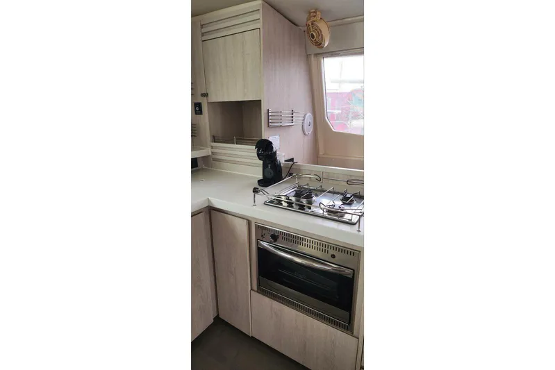 Jolly Dacha Yacht Photos Pics Modern kitchen in 2015 Leopard 48 yacht with stove, oven, and coffee maker.