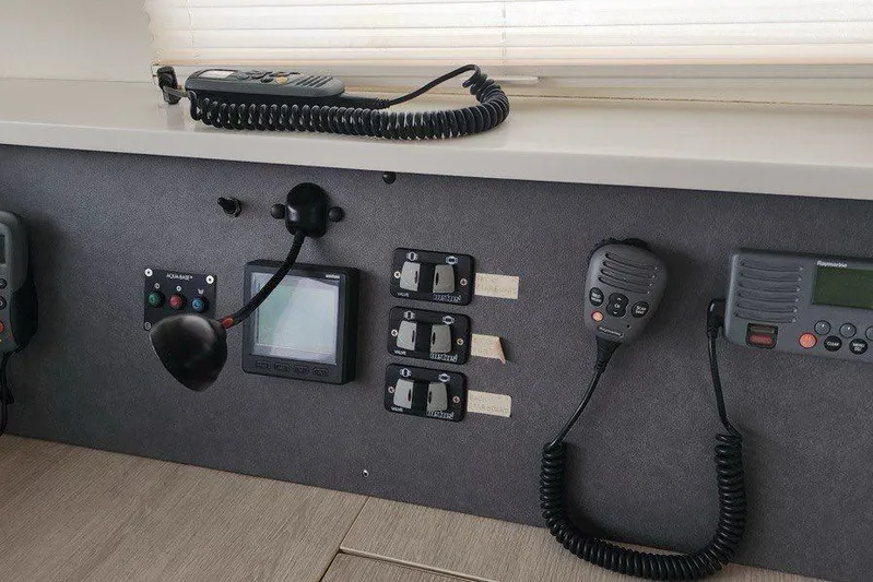 Jolly Dacha Yacht Photos Pics Control panel of a 2015 Leopard 48 yacht with communication devices and switches.