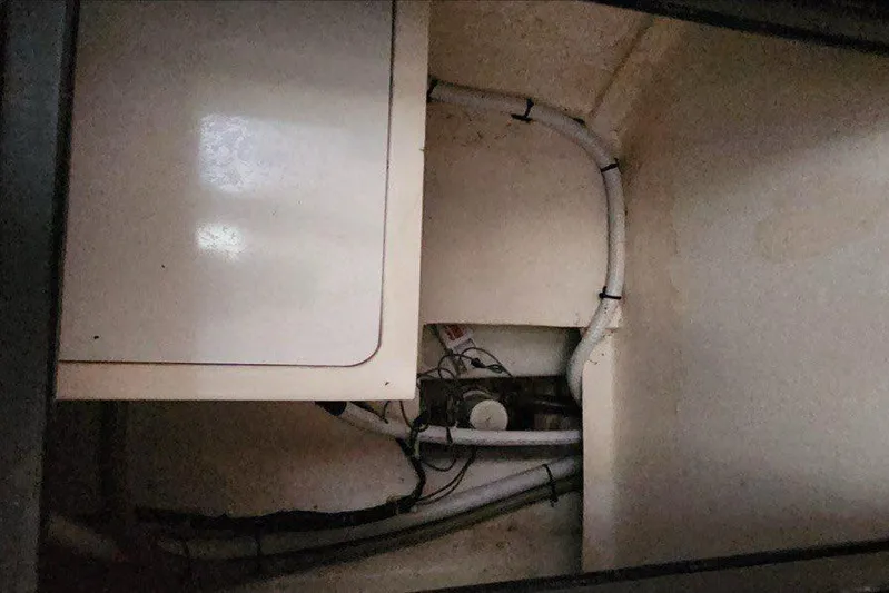 Jolly Dacha Yacht Photos Pics Engine compartment of a 2015 Leopard 48 yacht with visible wiring and pipes.