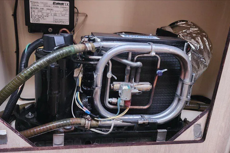 Jolly Dacha Yacht Photos Pics Leopard 48 yacht air conditioning unit, 2015 model, with visible wiring and tubing.