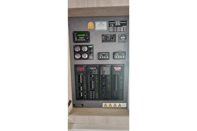 Jolly Dacha Yacht Photos Pics Electrical control panel of a 2015 Leopard 48 yacht with gauges and switches.