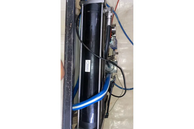 Jolly Dacha Yacht Photos Pics Hydraulic system component in a 2015 Leopard 48 yacht, featuring blue and black tubing.