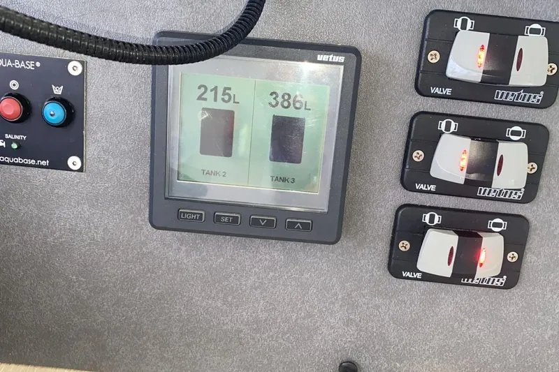 Jolly Dacha Yacht Photos Pics Control panel of a 2015 Leopard 48 yacht showing tank levels and valve switches.
