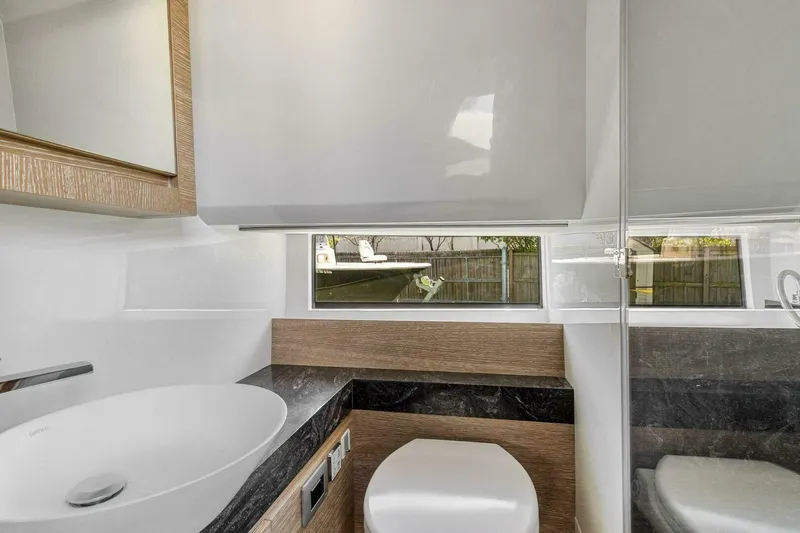  Yacht Photos Pics Modern bathroom interior of 2023 Astondoa 377 yacht, featuring sleek design and elegant fixtures.