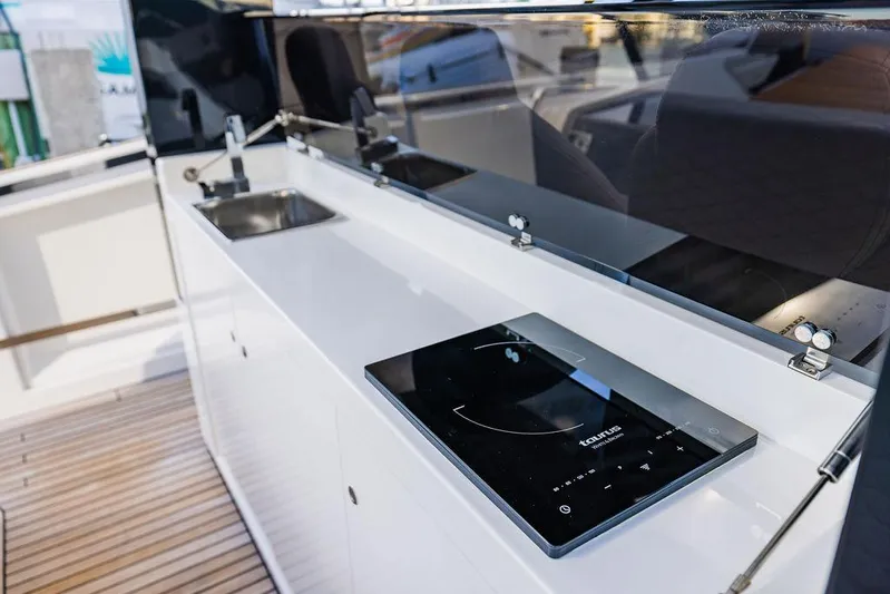  Yacht Photos Pics Modern kitchen area on 2023 Astondoa 377 yacht with sleek design and appliances.