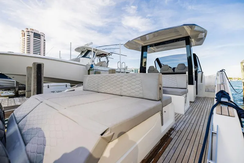  Yacht Photos Pics 2023 Astondoa 377 yacht with spacious deck and modern design at a marina.