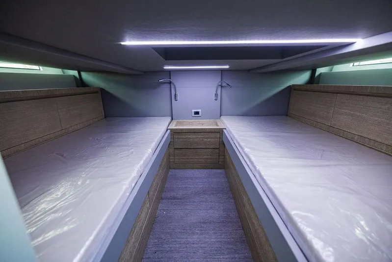  Yacht Photos Pics 2023 Astondoa 377 cabin interior with twin beds and modern lighting.