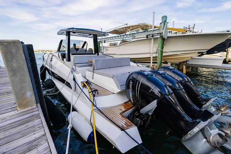  Yacht Photos Pics 2023 Astondoa 377 yacht docked with powerful outboard engines.