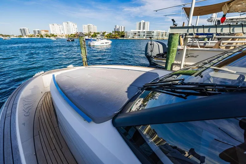  Yacht Photos Pics 2023 Astondoa 377 yacht docked with city skyline in background.